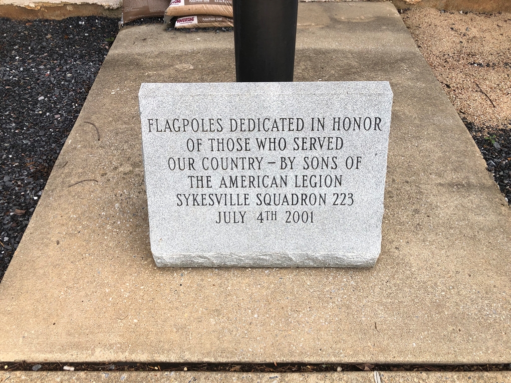SYKESVILLE SQUADRON 223 VETERANS MEMORIAL FLAGPOLES DEDICATION STONE