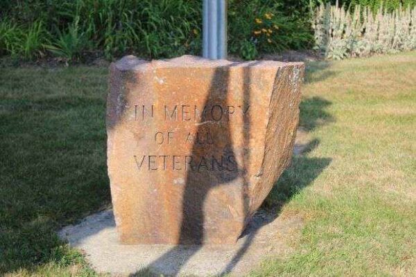 IN MEMORY OF ALL VETERANS MEMORIAL FLAGPOLE DEDICATION STONE