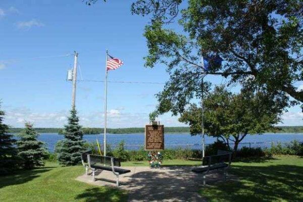 PHILLIPS VETERANS MEMORIAL MARKER WITH FLAGS