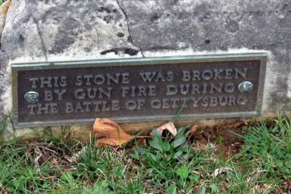 THIS STONE BROKEN BY GUN FIRE MEMORIAL PLAQUE