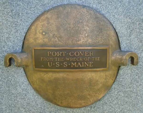 THE BATTLESHIP MAINE TEN INCH SHELL MEMORIAL PORT COVER