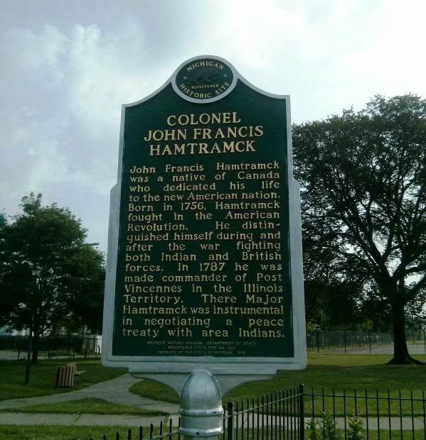 COLONEL JOHN FRANCIS HAMTRACK WAR MEMORIAL MARKER FRONT