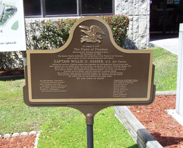 FLAME OF FREEDOM RELIGHTING THE FLAME MEMORIAL PLAQUE