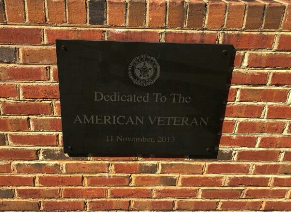 DEDICATED TO THE AMERICAN VETERAN MEMORIAL PLAQUE A