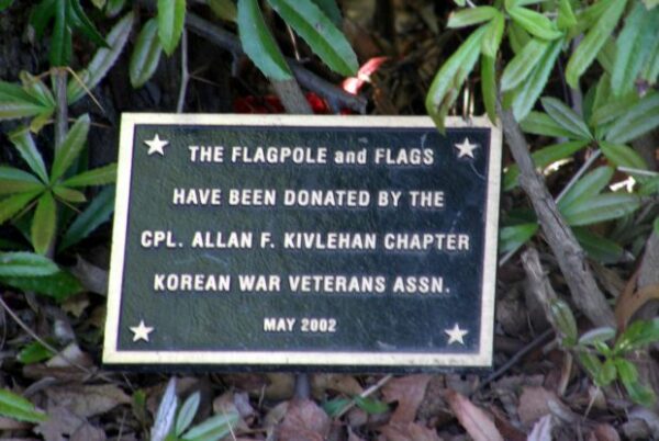 THE GREAT KILLS VETERANS PLAZA FLAGPOLE AND FLAGS MEMORIAL PLAQUE