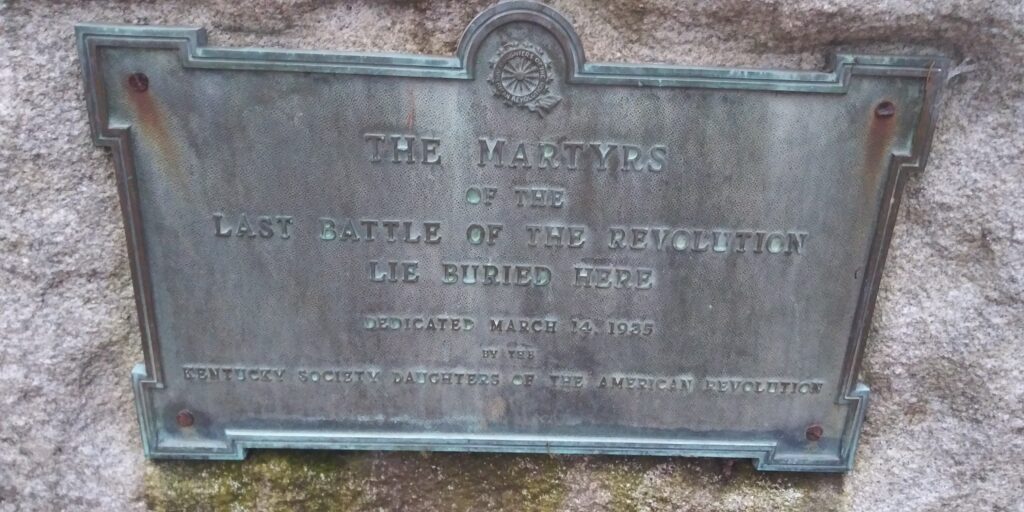 THE MARTYRS OF THE REVOLUTION LIE BURIED HERE MEMORIAL PLAQUE
