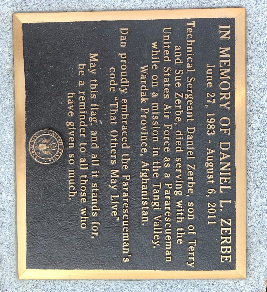 IN MEMORY OF DANIEL L. ZERBE WAR MEMORIAL FLAGPOLE PLAQUE