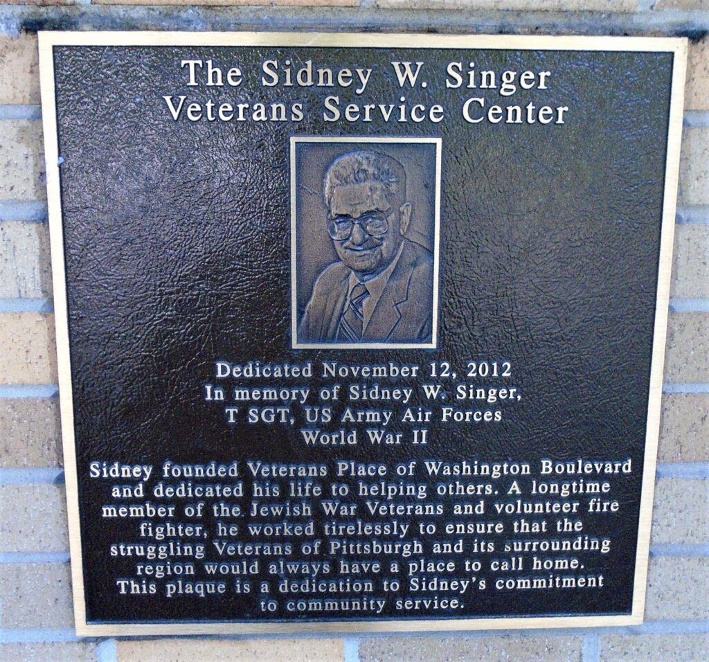 THE SIDNEY W. SINGER VETERANS SERVICE CENTER MEMORIAL PLAQUE