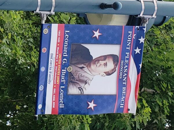 LEONARD G. “BUD” LOMELL WAR MEMORIAL BANNER