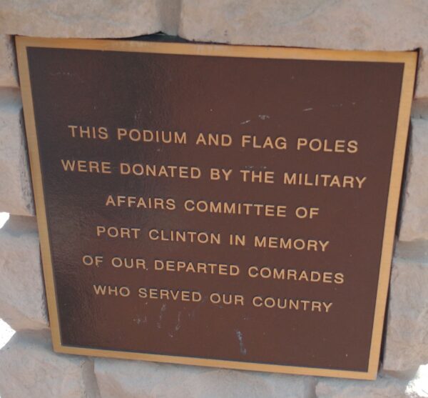 PODIUM AND FLAG POLES MEMORIAL PLAQUE