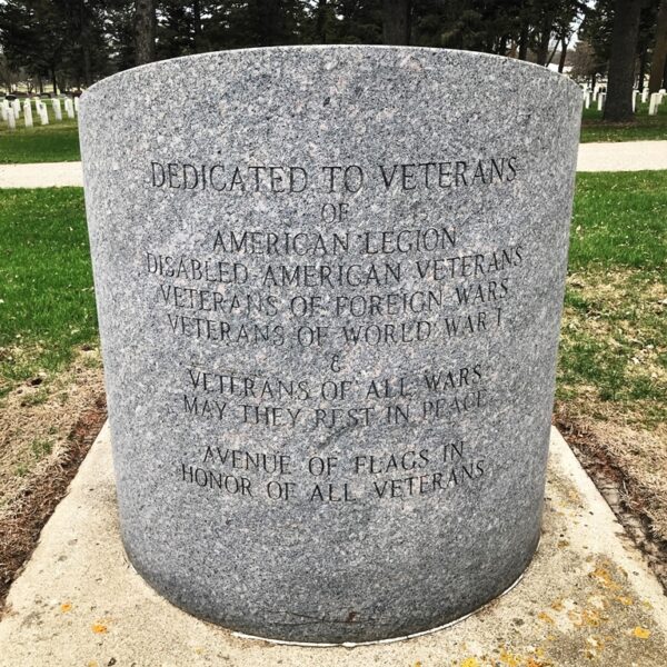 AVENUE OF FLAGS IN HONOR OF ALL VETERANS MEMORIAL STONE