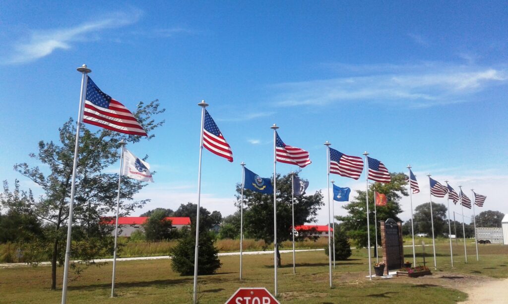 THESE FLAGS FLY MEMORIAL