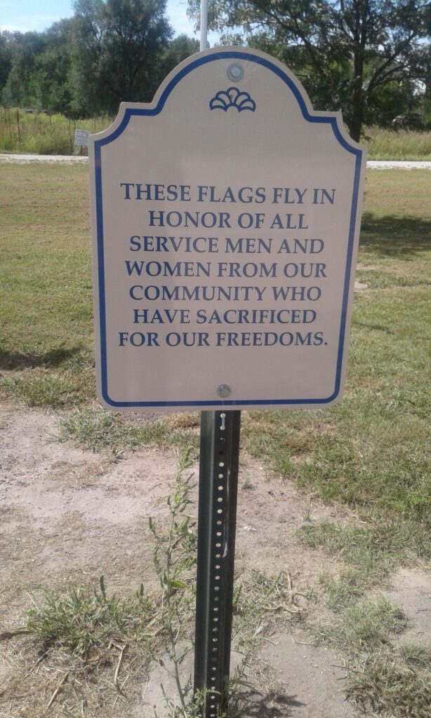 THESE FLAGS FLY MEMORIAL PLAQUE