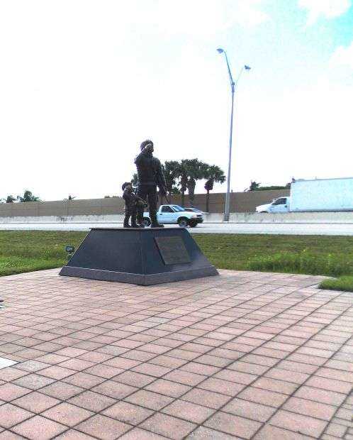 SALUTING KID AND SOLDIER WAR MEMORIAL