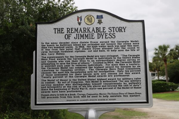 THE VALOR OF JIMMIE DYESS MEDAL OF HONOR WAR MEMORIAL MARKER BACK
