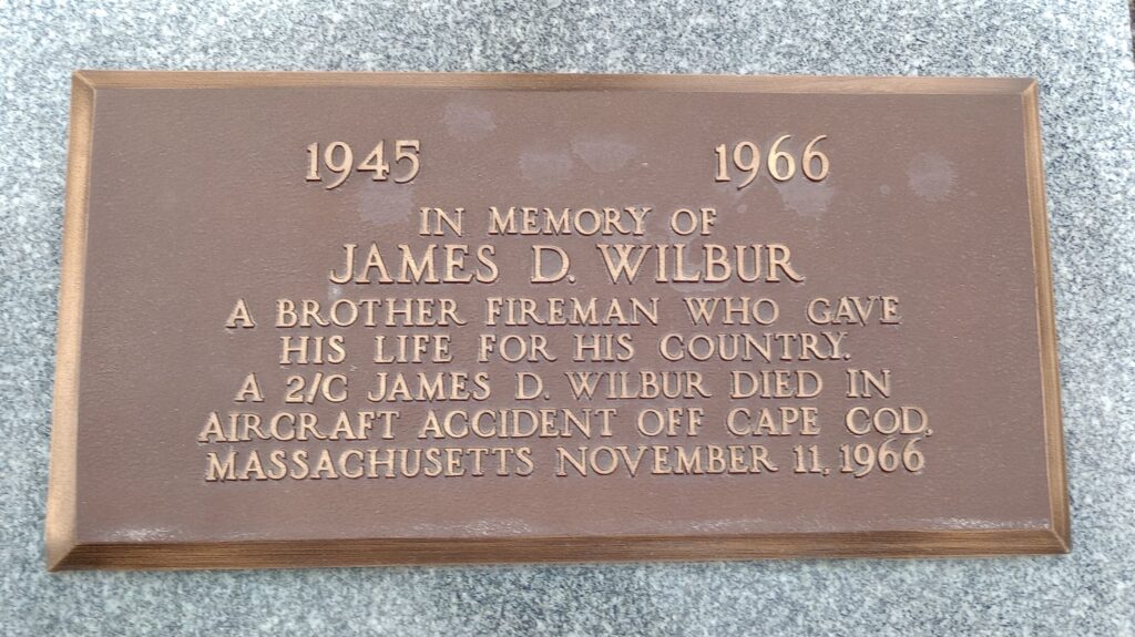 IN MEMORY OF JAMES D. WILBUR MEMORIAL PLAQUE