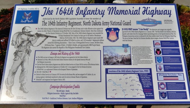 THE 164TH INFANTRY MEMORIAL HIGHWAY PLAQUE