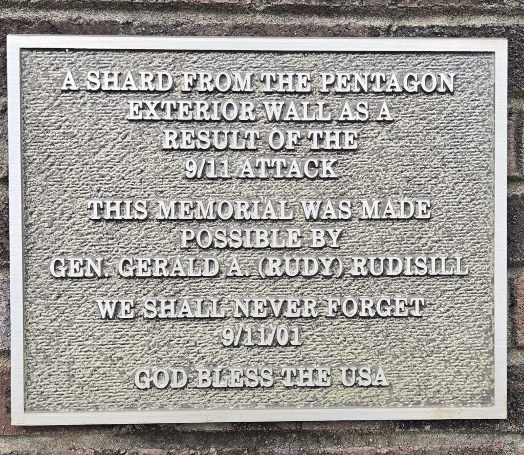 A SHARD FROM THE PENTAGON EXTERIOR WALL MEMORIAL PLAQUE
