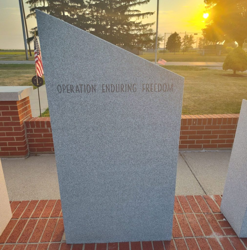 IN MEMORY OF ALL WHO SERVED DEDICATED TO POW’S & MIA’S WAR MEMORIAL STONE K