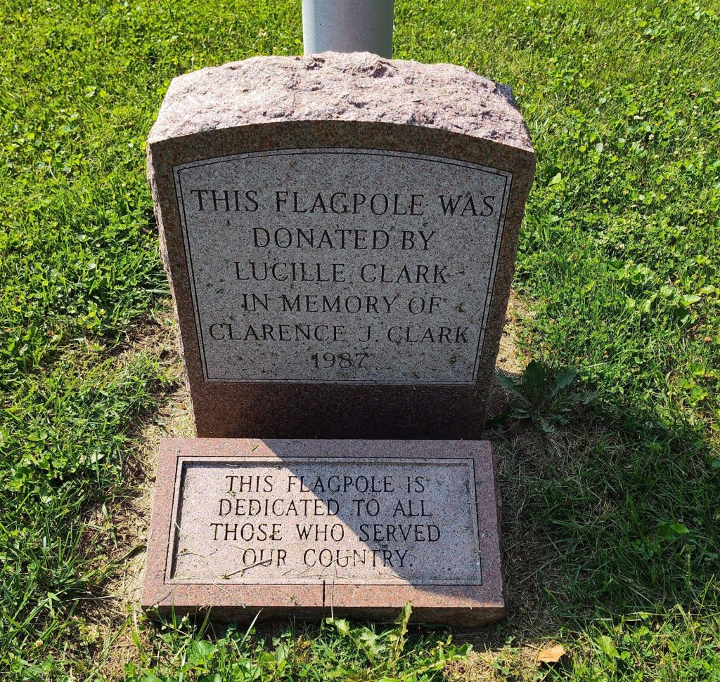 LUCILLE CLARK VETERANS MEMORIAL FLAGPOLE STONE
