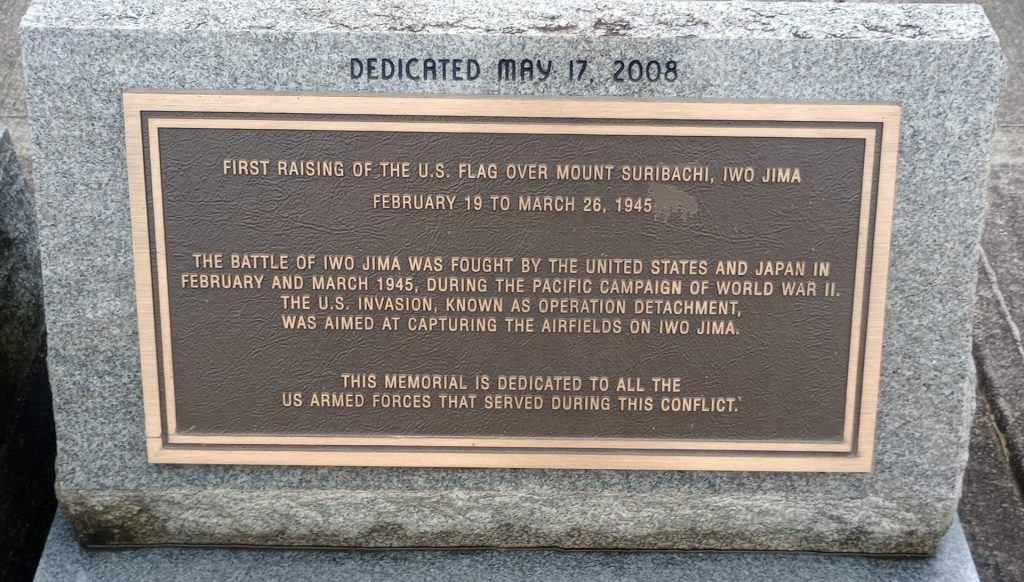 FIRST RAISING OF THE U.S. FLAG OVER MOUNT SURIBACHI MEMORIAL PLAQUE A
