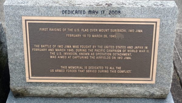 FIRST RAISING OF THE U.S. FLAG OVER MOUNT SURIBACHI MEMORIAL PLAQUE A