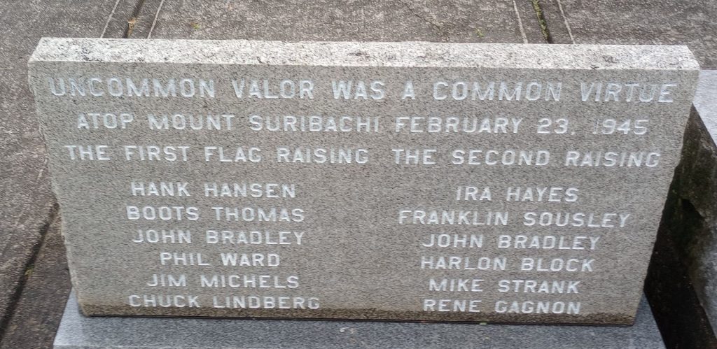 FIRST RAISING OF THE U.S. FLAG OVER MOUNT SURIBACHI MEMORIAL STONE A