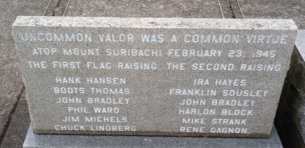 FIRST RAISING OF THE U.S. FLAG OVER MOUNT SURIBACHI MEMORIAL STONE A