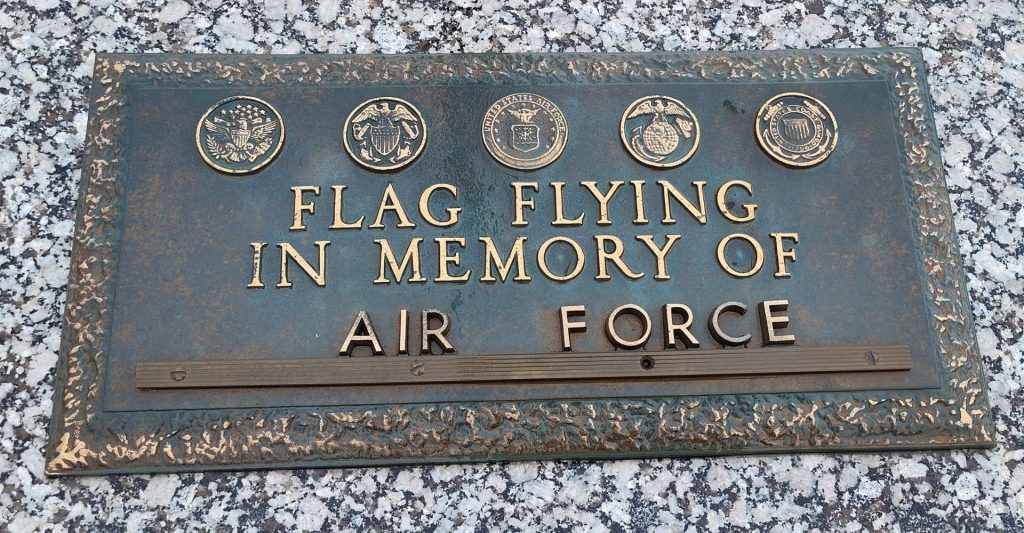 FLAG FLYING IN MEMORY OF AIR FORCE MEMORIAL PLAQUE