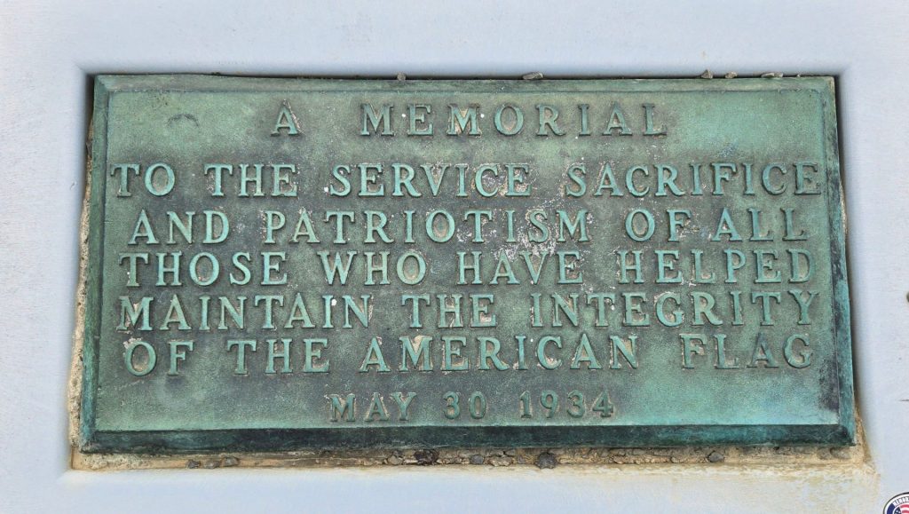 A MEMORIAL FLAGPOLE PLAQUE