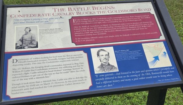 THE BATTLE BEGINS: CONFEDERATE CAVALRY BLOCKS THE GOLDSBORO ROAD MEMORIAL PANEL
