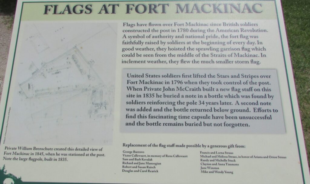 FLAGS AT FORT MACKINAC MEMORIAL PLAQUE