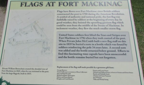 FLAGS AT FORT MACKINAC MEMORIAL PLAQUE