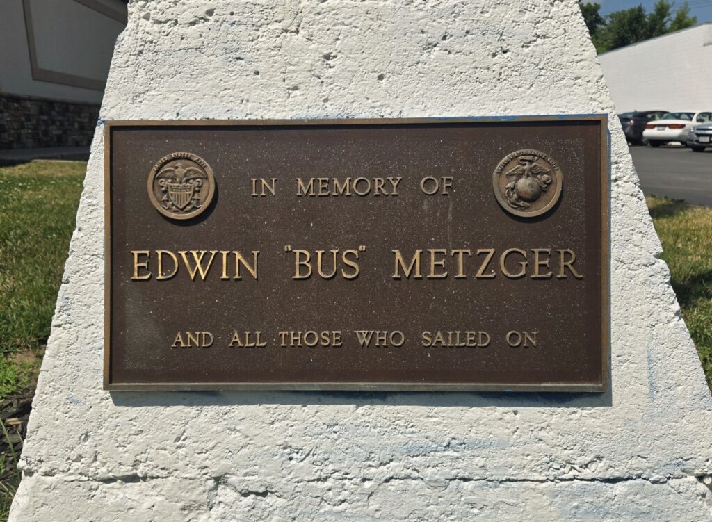 EDWIN “BUS” METZGER WAR MEMORIAL FLAGPOLE PLAQUE